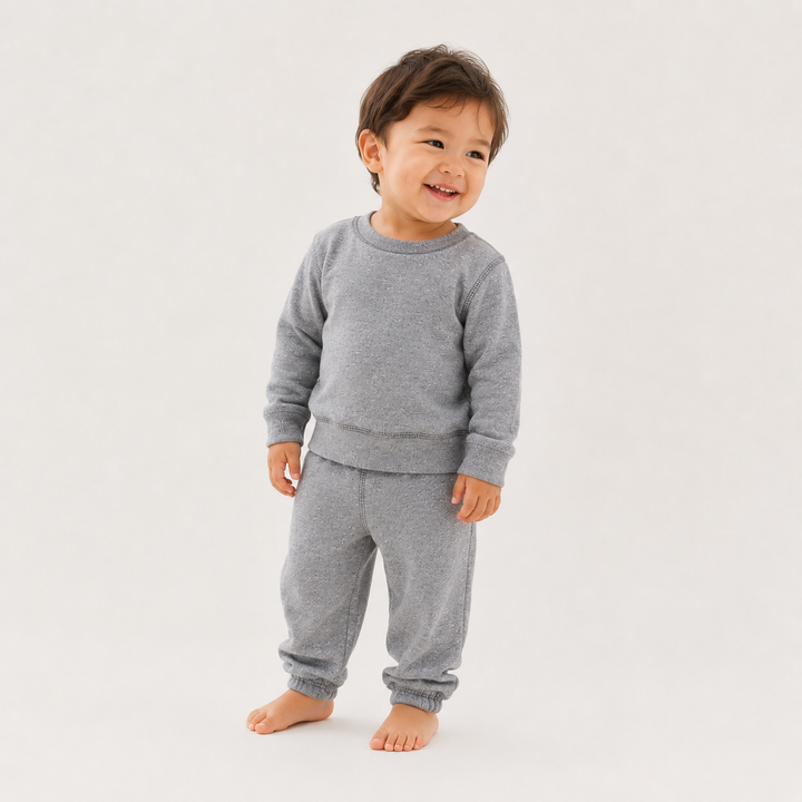 Baby wearing PAIGELAUREN Heathered Gray Fleece Sweatshirt and Pant Set