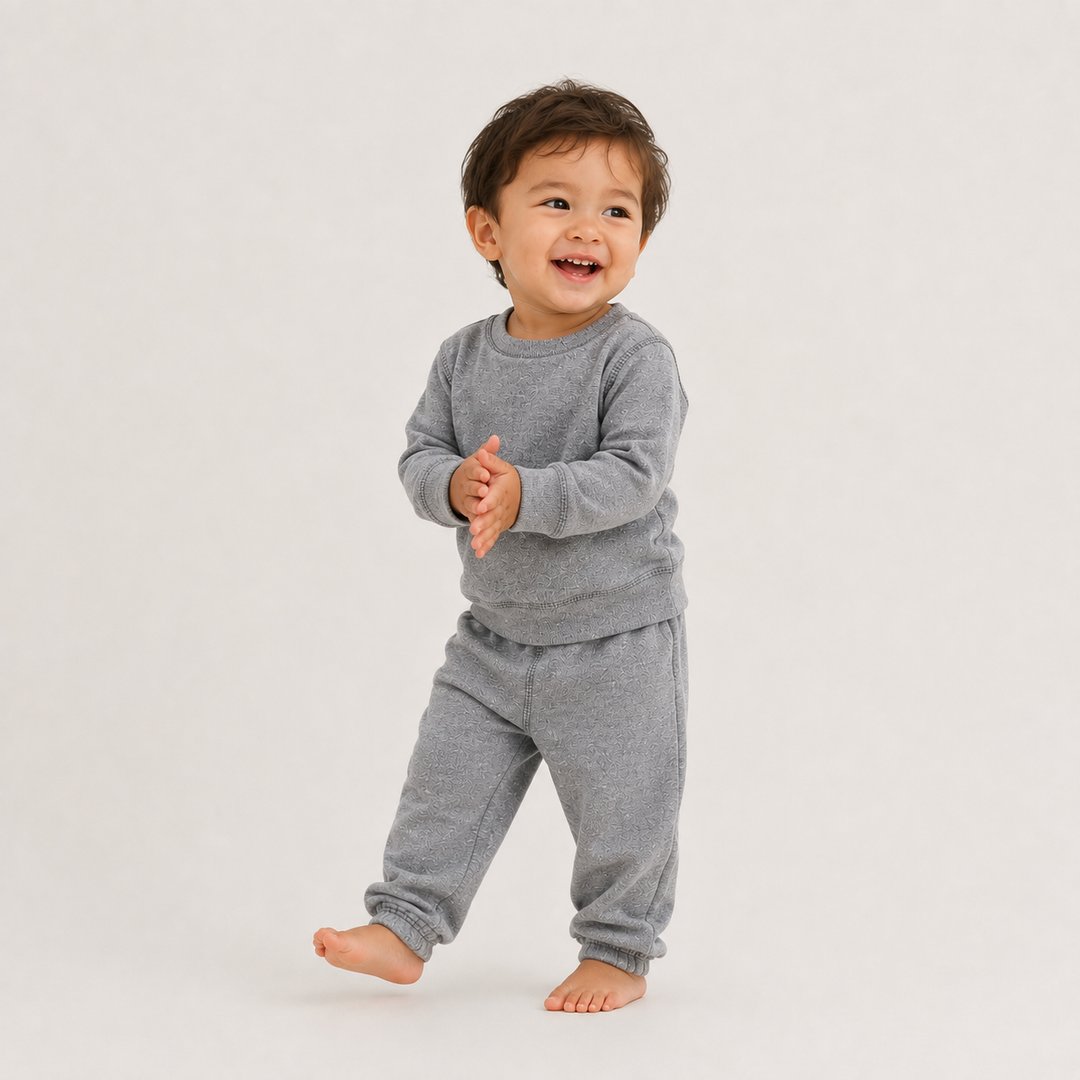 Toddler wearing PAIGELAUREN Heathered Gray Fleece Sweatshirt and Pant Set