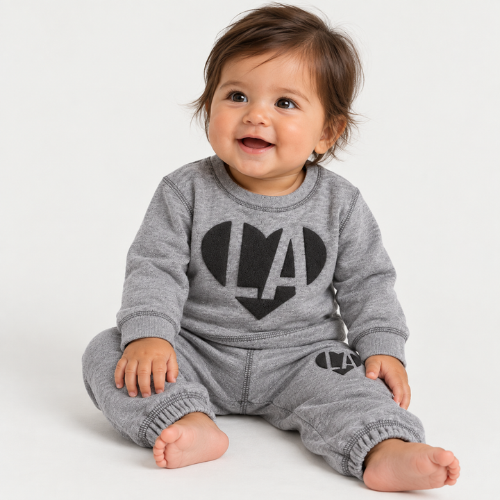 Baby wearing PAIGELAUREN Heathered Gray Fleece Puffed Heart LA Sweat Set