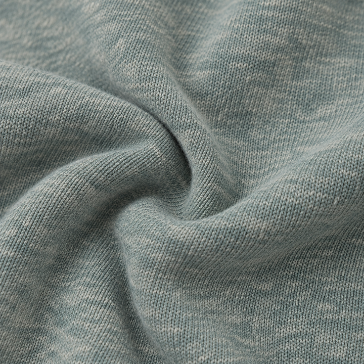 Close-up of PAIGELAUREN Heathered Green Vintage Sherpa fabric
