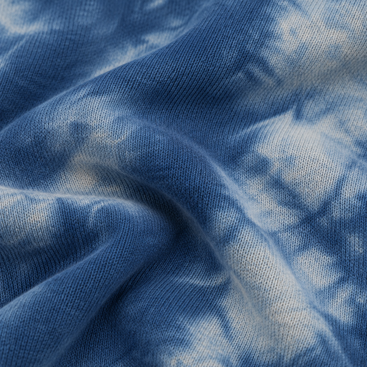Close-up of PAIGELAUREN Blue Heathered Marble Fleece fabric