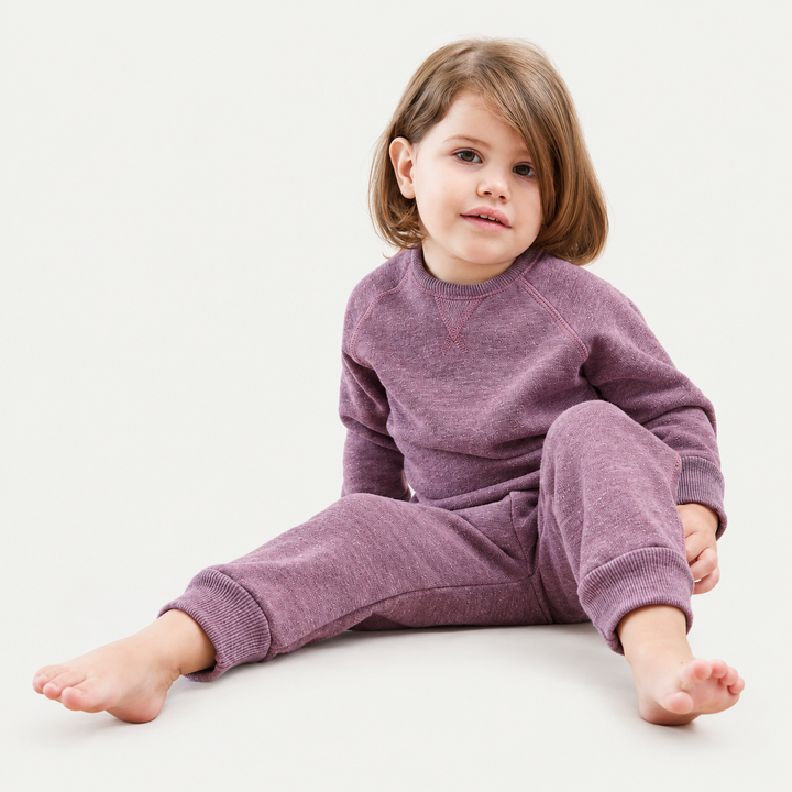 Toddler wearing PAIGELAUREN Heathered Pink Vintage Sherpa Sweatshirt and Sweatpant Set