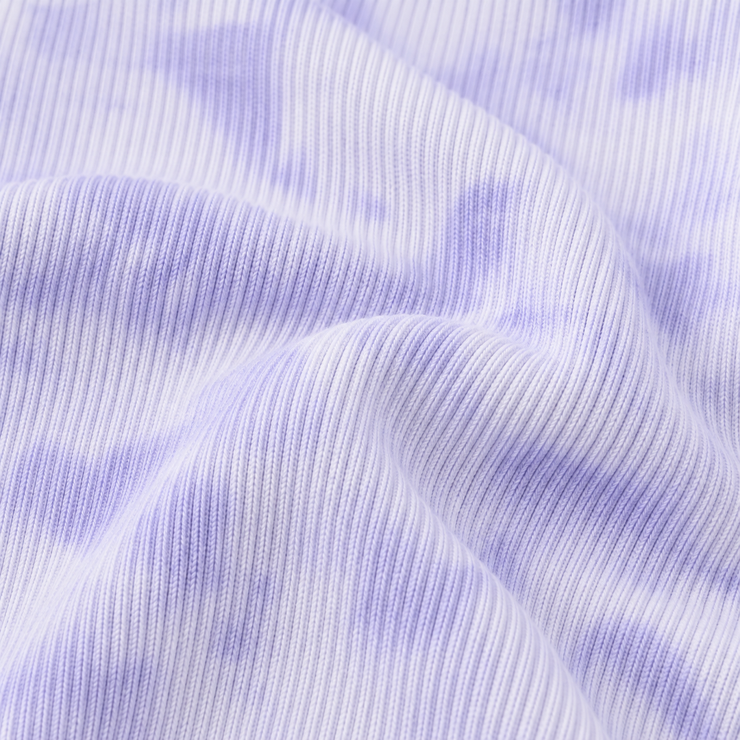 Close-up of PAIGELAUREN Lavender Marble 2x1 Rib fabric and hand-dyed texture