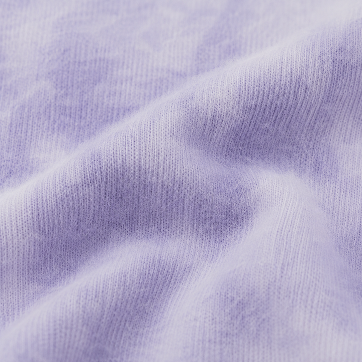 Close-up of ultra-soft Lavender Marble brushed hacci fabric with fuzzy texture