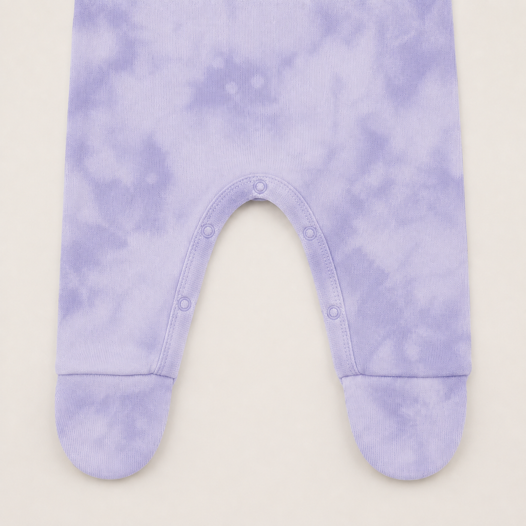 nseam snap closure and built-in footie detail on Lavender Marble Brushed Hacci Romper