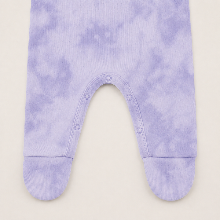nseam snap closure and built-in footie detail on Lavender Marble Brushed Hacci Romper