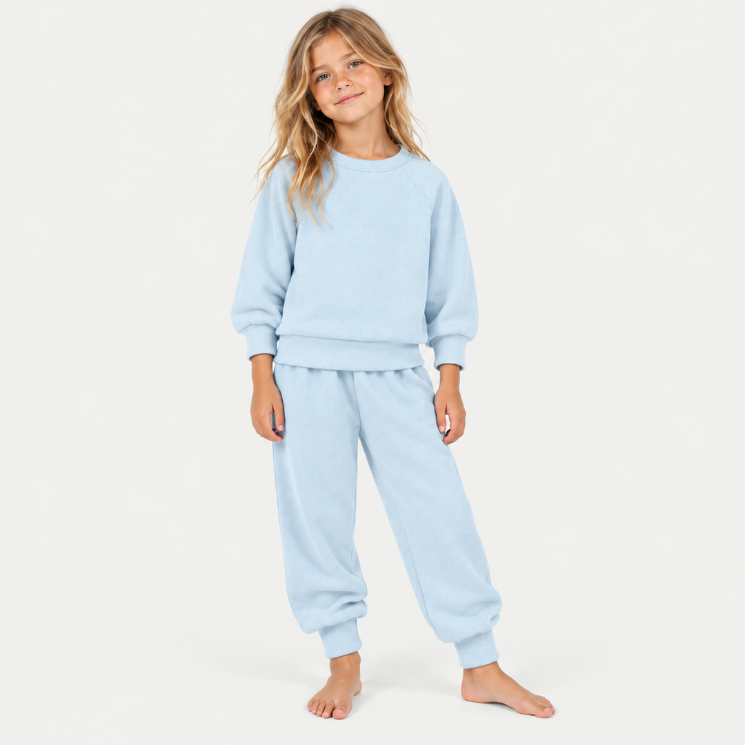 Girl wearing PAIGELAUREN Light Blue Fleece Sweatshirt and Sweatpant Set