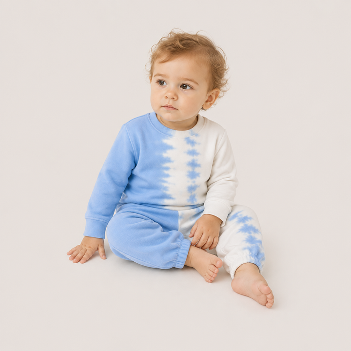 Baby wearing the PAIGELAUREN Super Soft Fleece Tie Dye Set in Light Blue Tie Dye