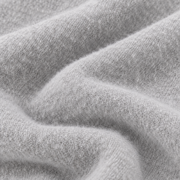 Close-up of soft fuzzy Light Heather Gray brushed fleece fabric