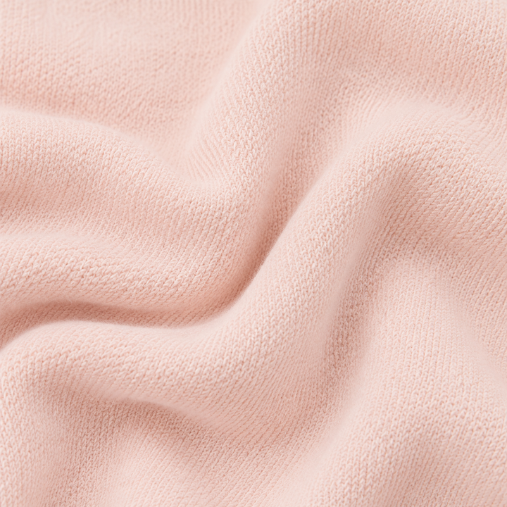 Close-up of soft PAIGELAUREN Light Pink fleece fabric