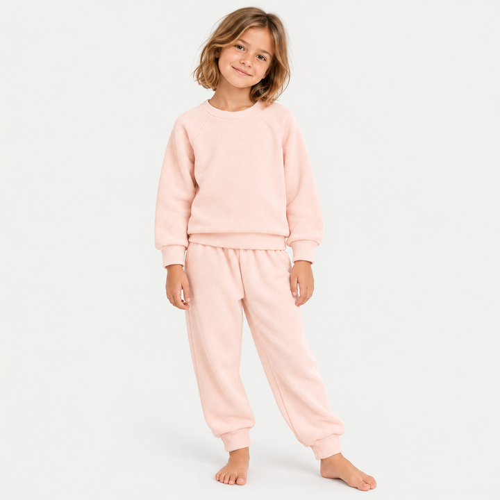 Girl wearing PAIGELAUREN Light Pink Fleece Sweatshirt and Sweatpant Set