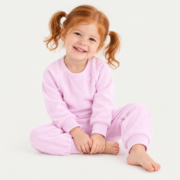 Toddler wearing PAIGELAUREN Lilac Sherpa Raglan Sweatshirt and Jogger Set