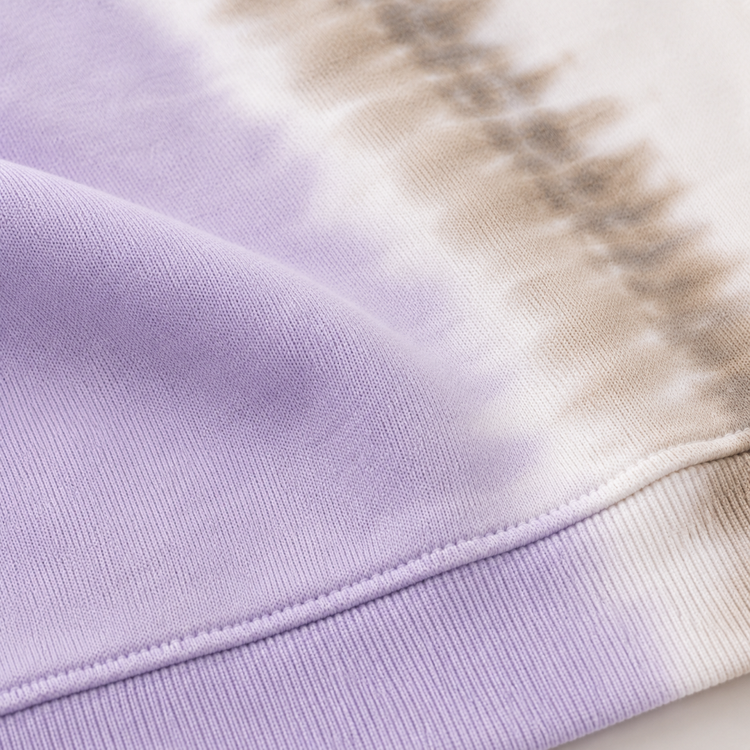Close-up of PAIGELAUREN super soft fleece and hand-dyed Lilac Tie Dye finish
