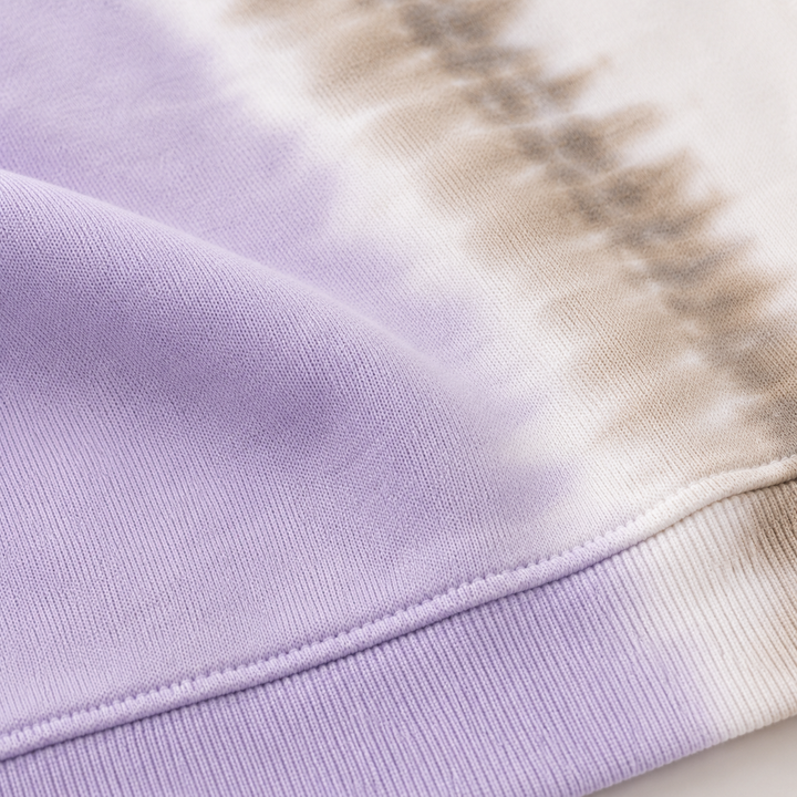 Close-up of PAIGELAUREN super soft fleece and hand-dyed Lilac Tie Dye finish