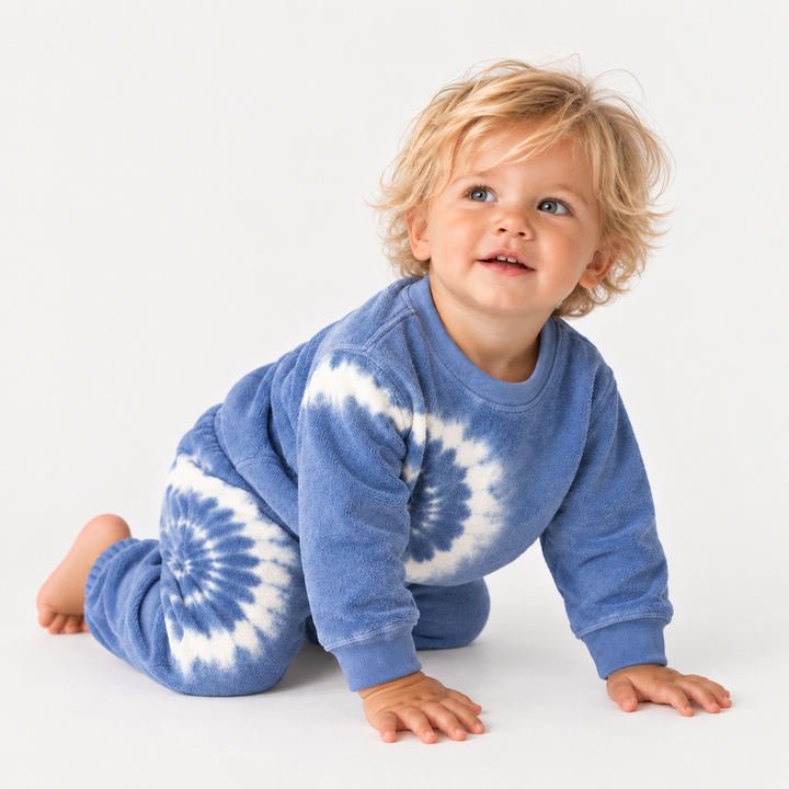 Toddler in PAIGELAUREN Blue Tie Dye Loop Terry Pullover and Pant Set
