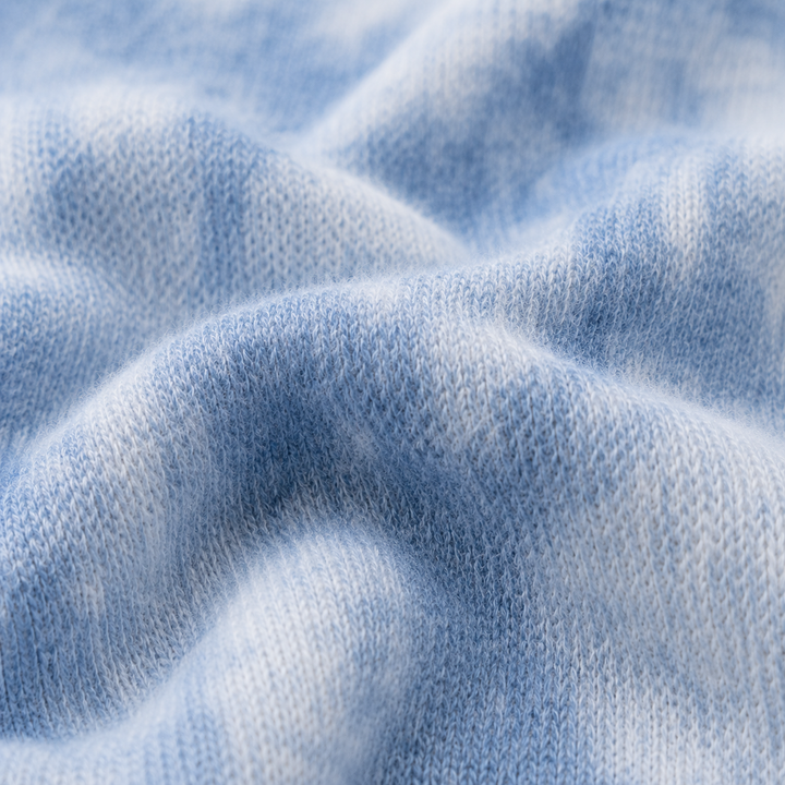 Close-up of soft blue marble brushed hacci fabric by PAIGELAUREN