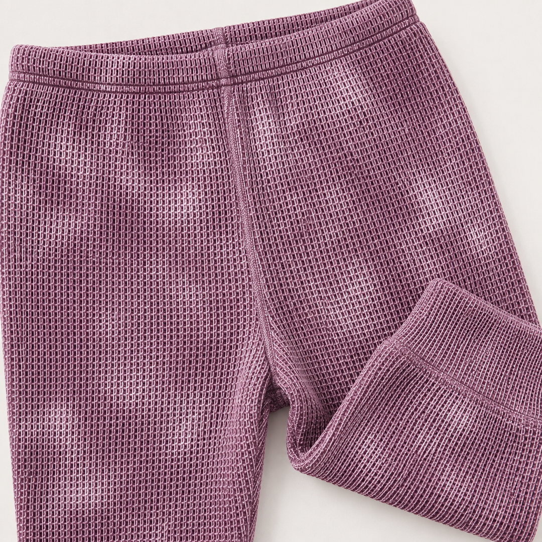 Marble Plum Thermal legging detail showing hand-marble dye, thermal texture and ribbed cuff