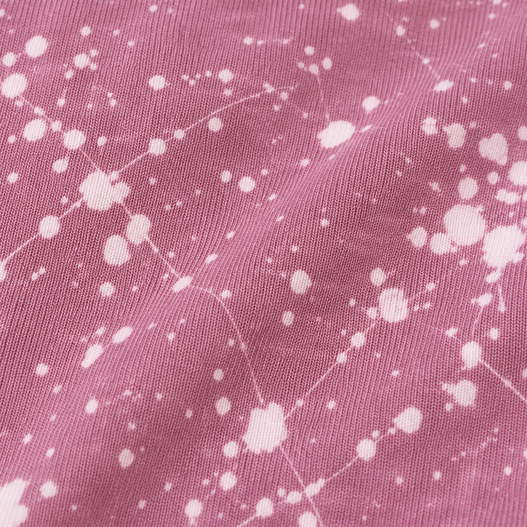 Close-up of PAIGELAUREN Mauve Splatter Brushed Rib fabric and dye effect