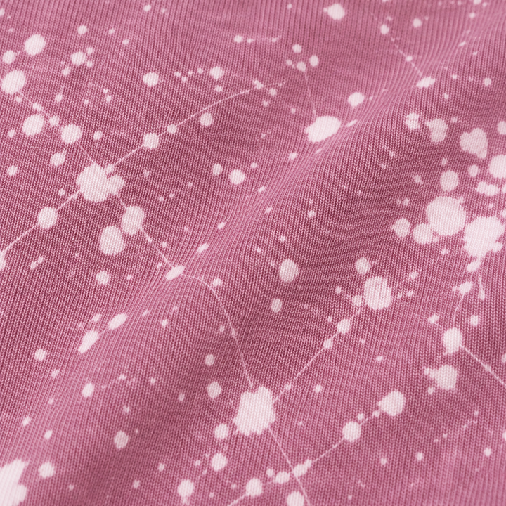 Close-up of PAIGELAUREN Mauve Splatter Brushed Rib fabric and dye effect