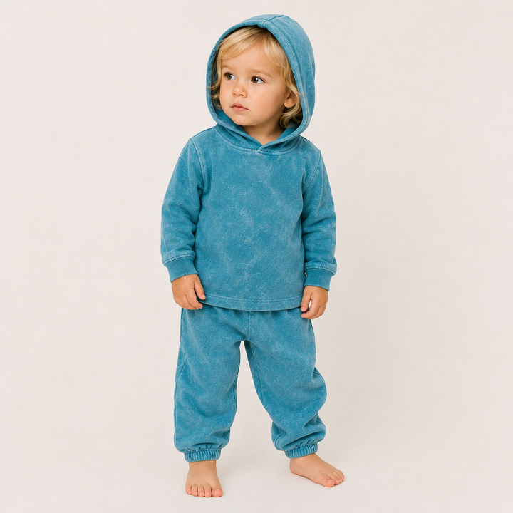 Toddler wearing PAIGELAUREN Mineral Aqua Rib Hoodie & Baggy Pant Set with hood up