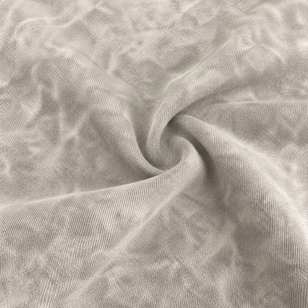 Close-up of soft baby rib fabric with mineral wash texture in Gray