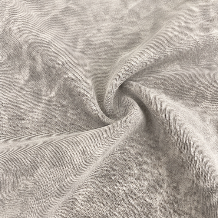 Close-up of soft baby rib fabric with mineral wash texture in Gray