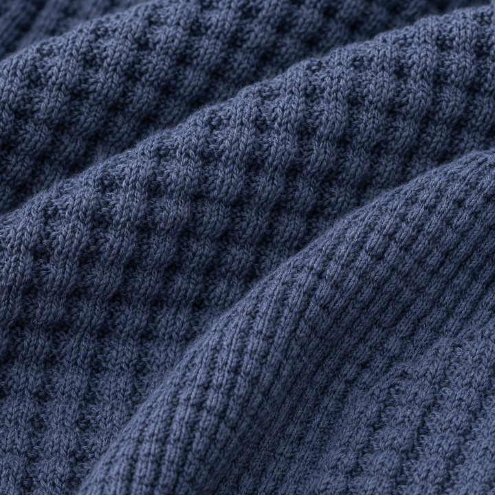 Close-up of the PAIGELAUREN navy Chunky Thermal waffle knit texture.