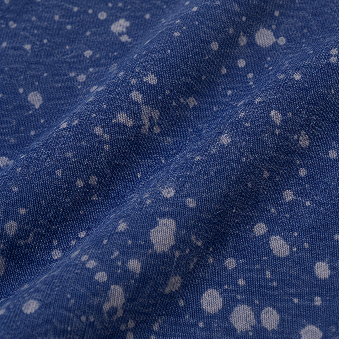 Close-up of PAIGELAUREN Navy Splatter Brushed Rib fabric and dye effect