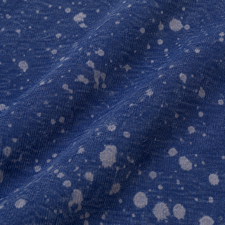 Close-up of PAIGELAUREN Navy Splatter Brushed Rib fabric and dye effect
