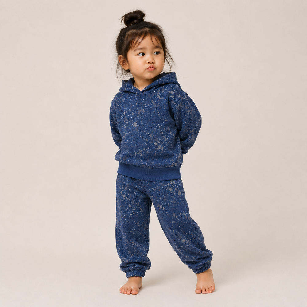 Toddler wearing PAIGELAUREN Navy Splatter Brushed Rib Hoodie and Balloon Pant Set