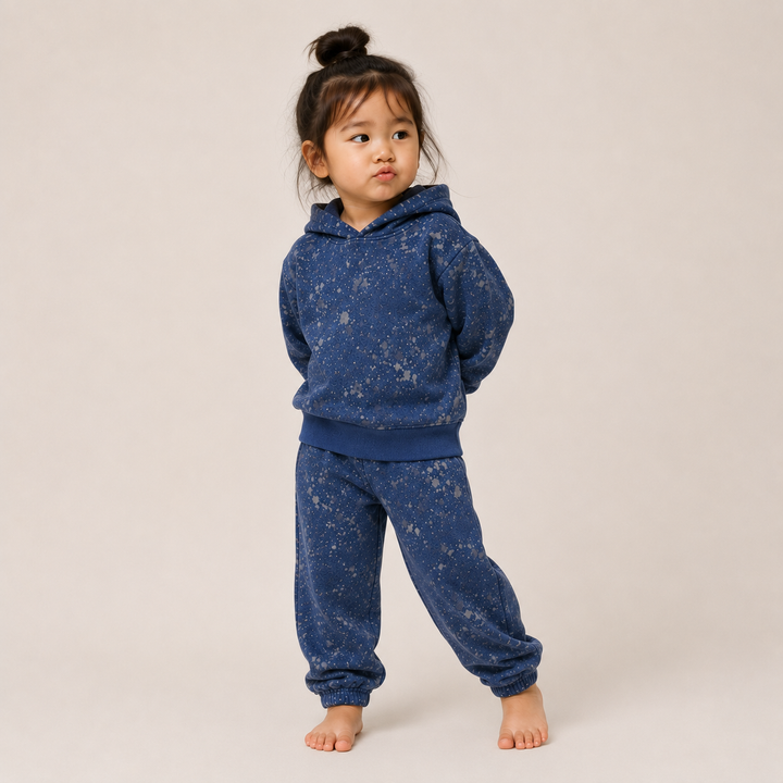 Toddler wearing PAIGELAUREN Navy Splatter Brushed Rib Hoodie and Balloon Pant Set