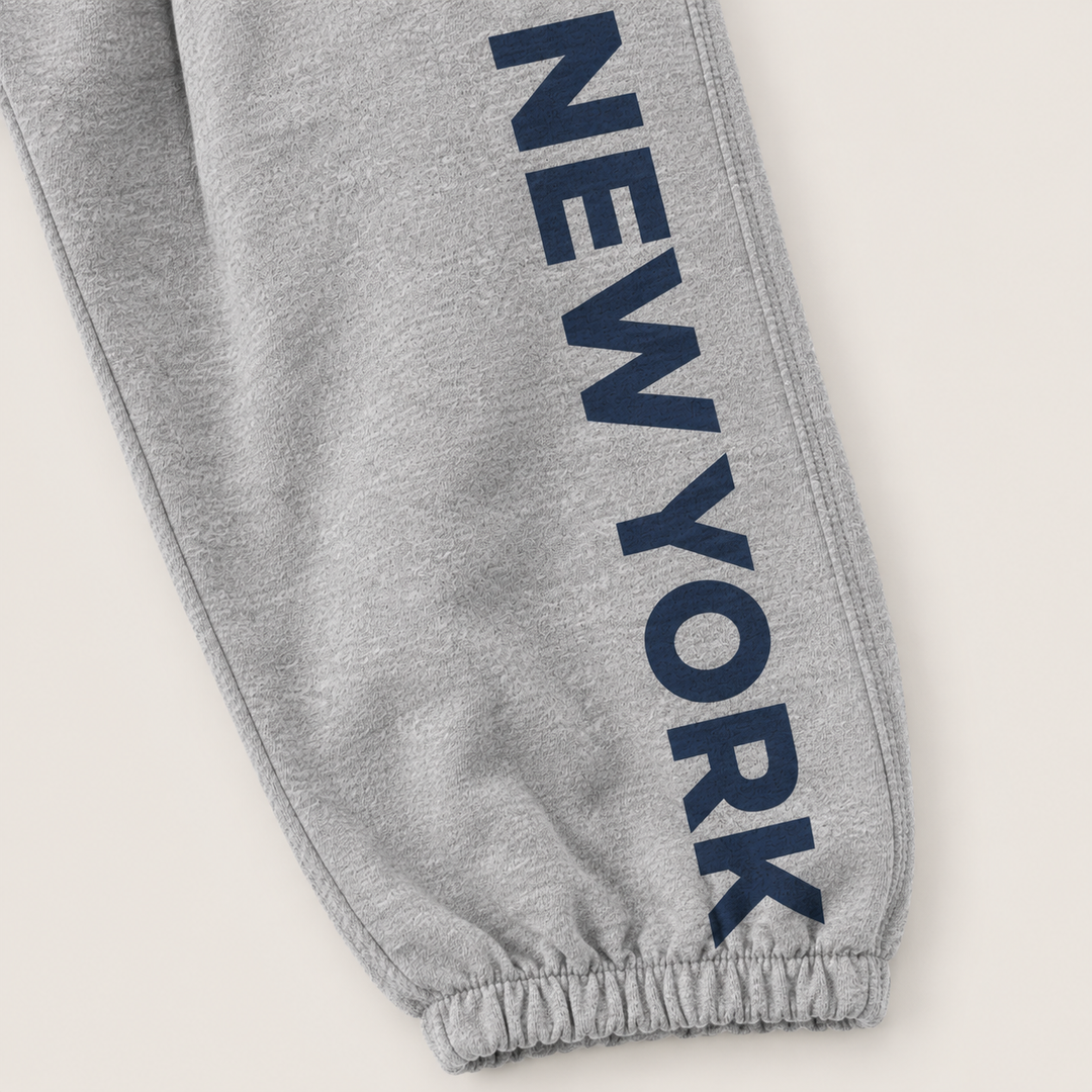 Close-up of New York graphic and gathered elastic ankle on PAIGELAUREN fleece sweatpant