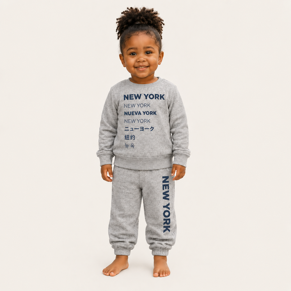 Toddler wearing PAIGELAUREN New York graphic Vintage Heathered Fleece loungewear set