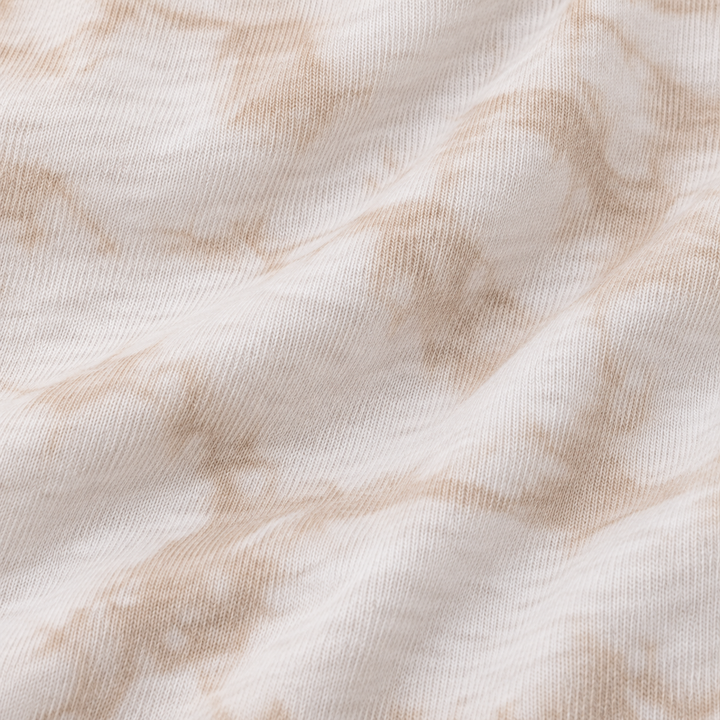 Close-up of PAIGELAUREN Oat Crystal Rib fabric and hand-dyed texture