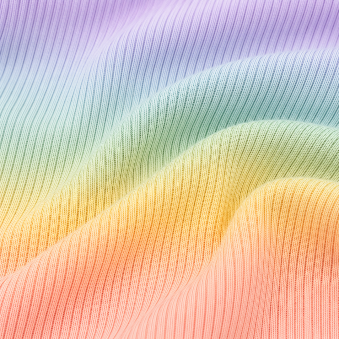 Close-up of PAIGELAUREN Pastel Rainbow Dip Dye 2x1 rib fabric texture