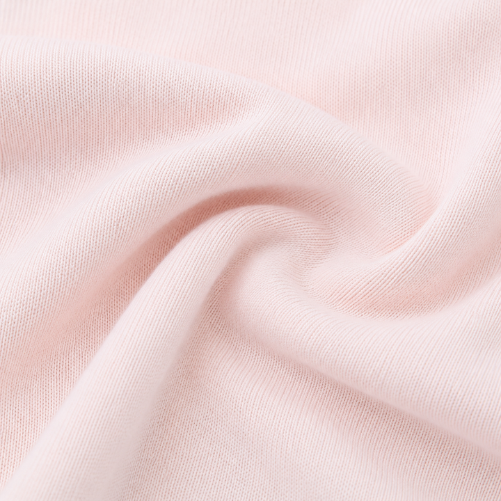 Close-up of soft PAIGELAUREN Pink Fleece fabric showing its cozy knit texture