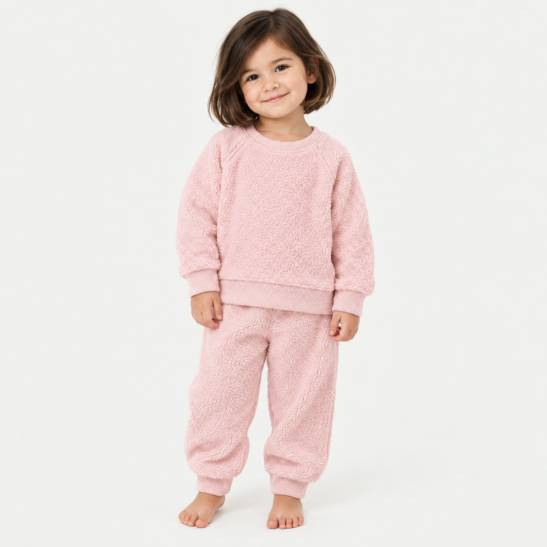 Girl wearing PAIGELAUREN Pink Fluffy Sherpa Sweatshirt and Jogger Set