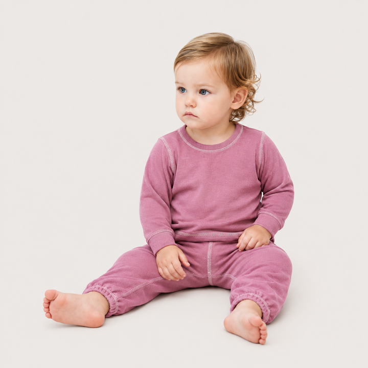baby sitting and wearing PAIGELAUREN Lightweight Pink Hacci Pullover & Pant Loungewear Set