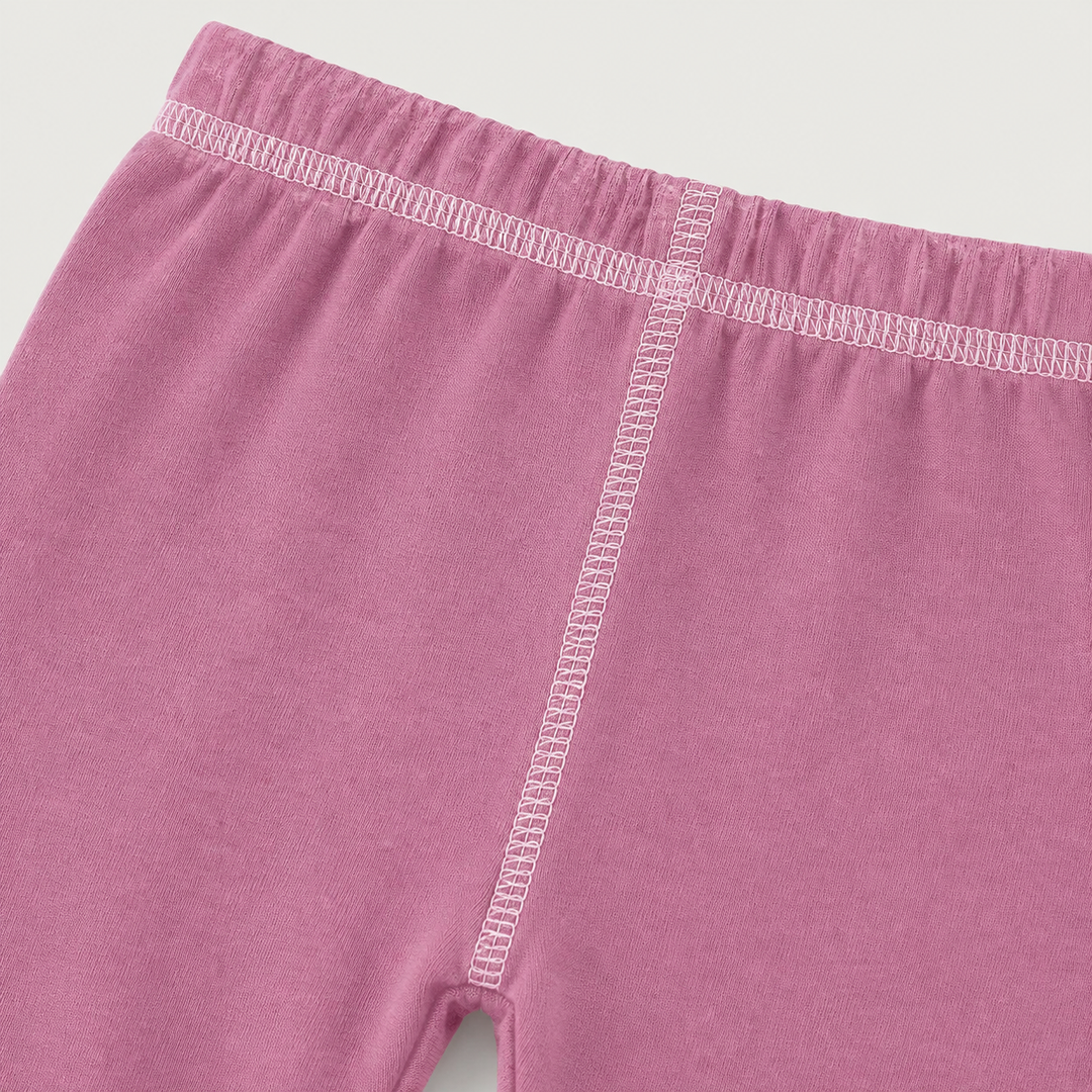 Close-up of PAIGELAUREN Pink Hacci Pant with light pink contrast topstitching