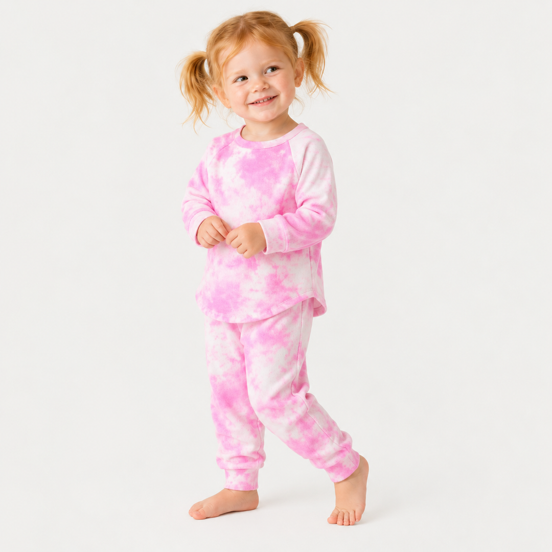 Toddler wearing PAIGELAUREN pink marble French terry tee and jogger set