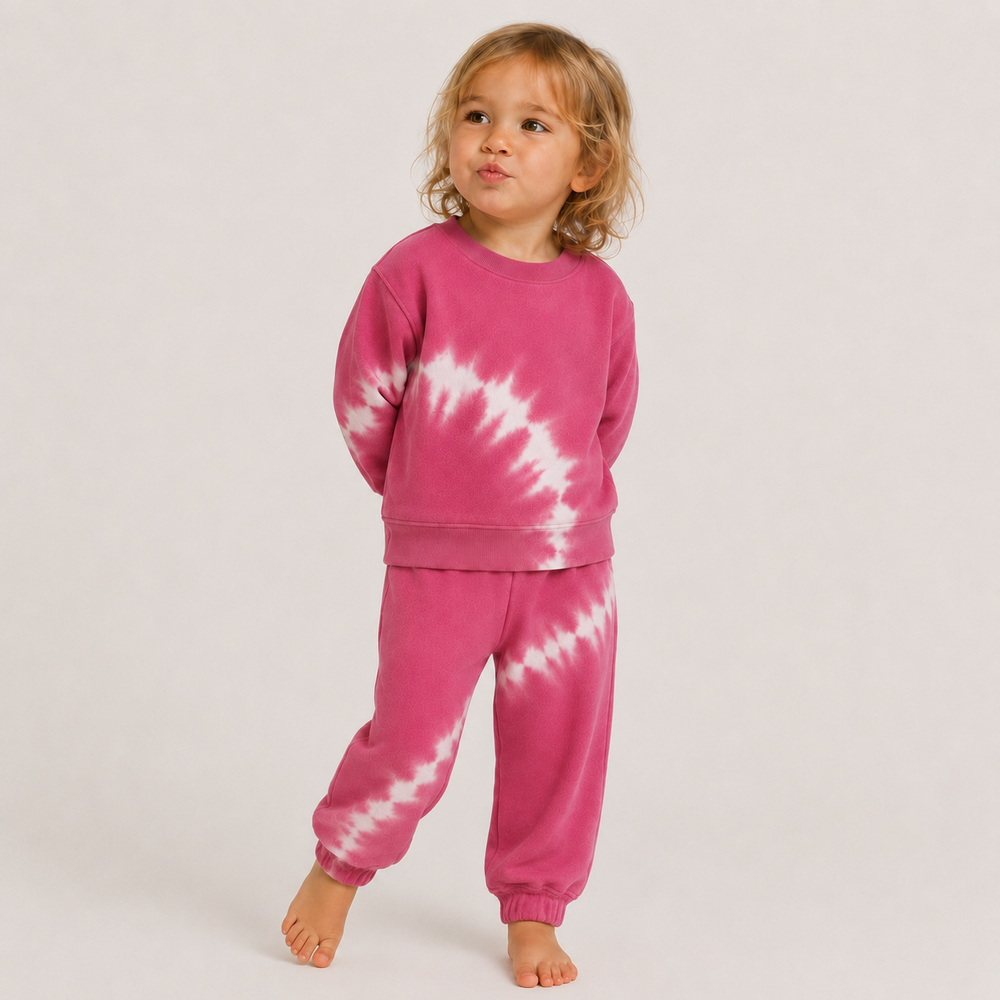 Toddler wearing PAIGELAUREN Pink Tie Dye Fleece Sweatshirt and Sweatpant Set