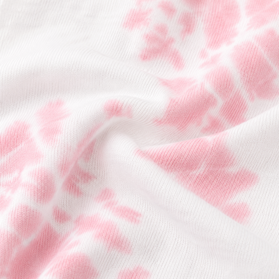 Close-up of PAIGELAUREN Pink and White tie dye ribbed fabric