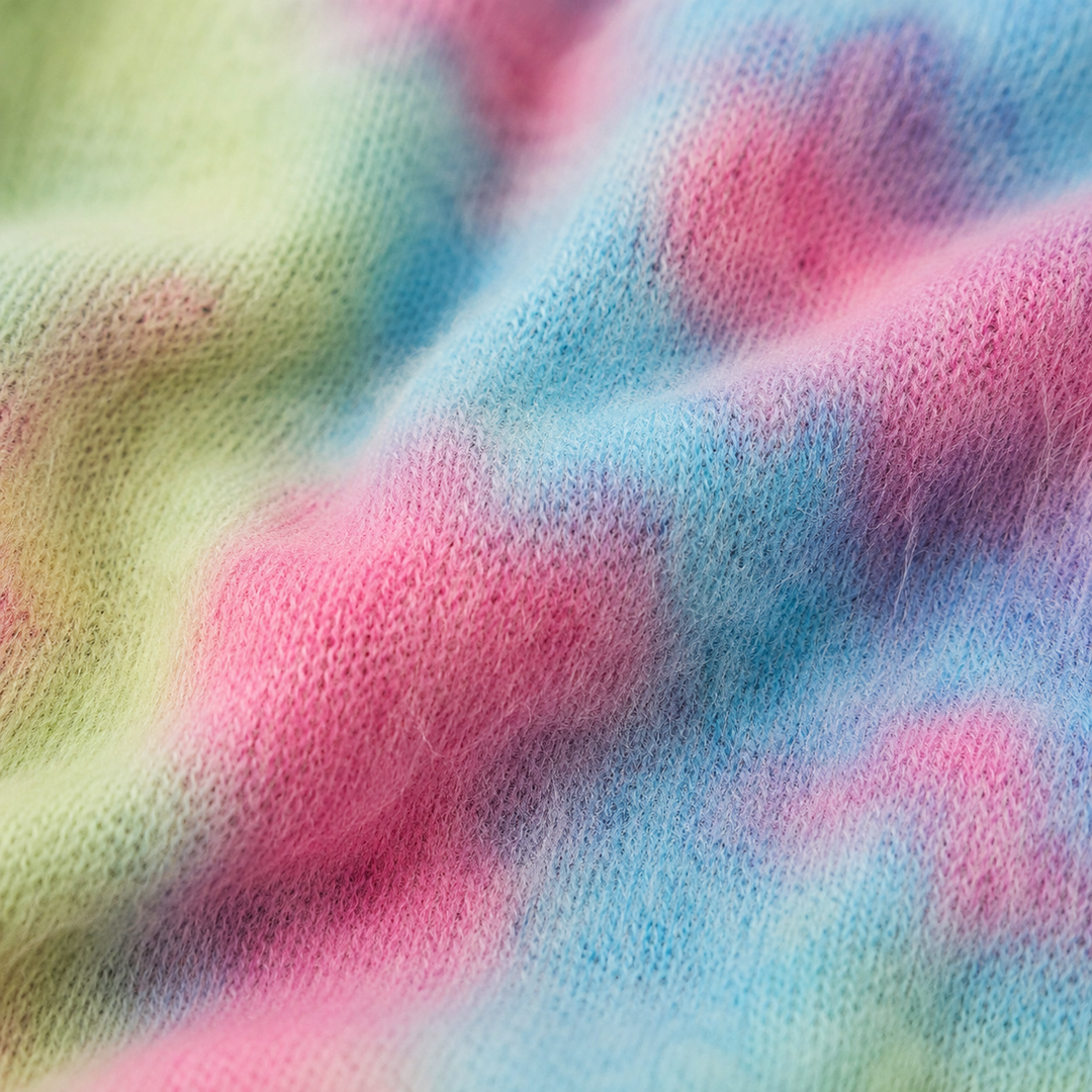 Close-up of soft fuzzy Rainbow Brushed Hacci Tie Dye fabric