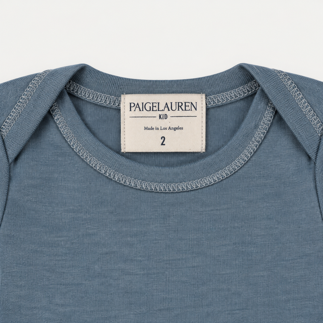 PAIGELAUREN Blue Rib Lap Tee lap shoulder neckline and label detail
