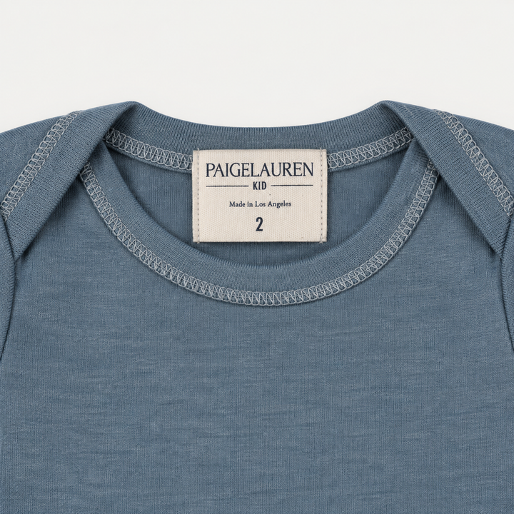 PAIGELAUREN Blue Rib Lap Tee lap shoulder neckline and label detail