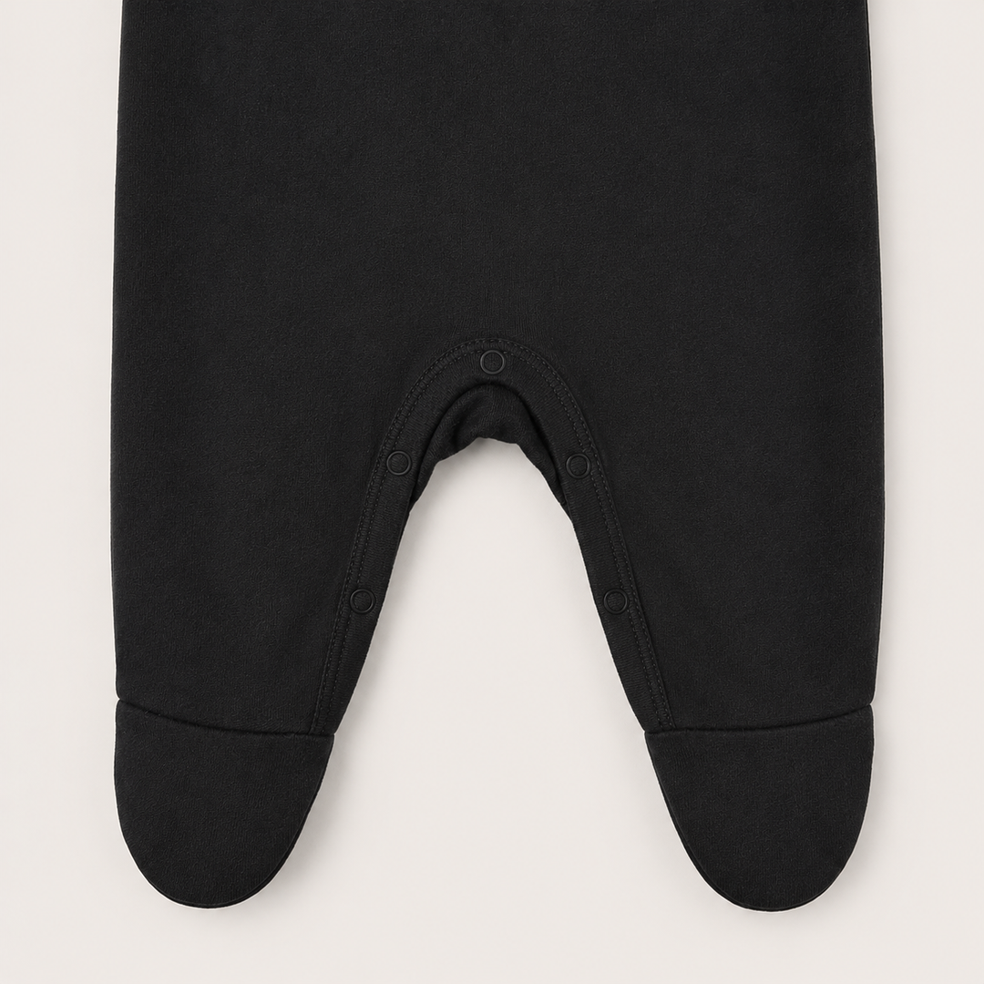 Tonal snap closure detail on PAIGELAUREN Black Rib Lap Tee Footie Pajama