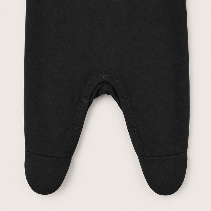 Tonal snap closure detail on PAIGELAUREN Black Rib Lap Tee Footie Pajama