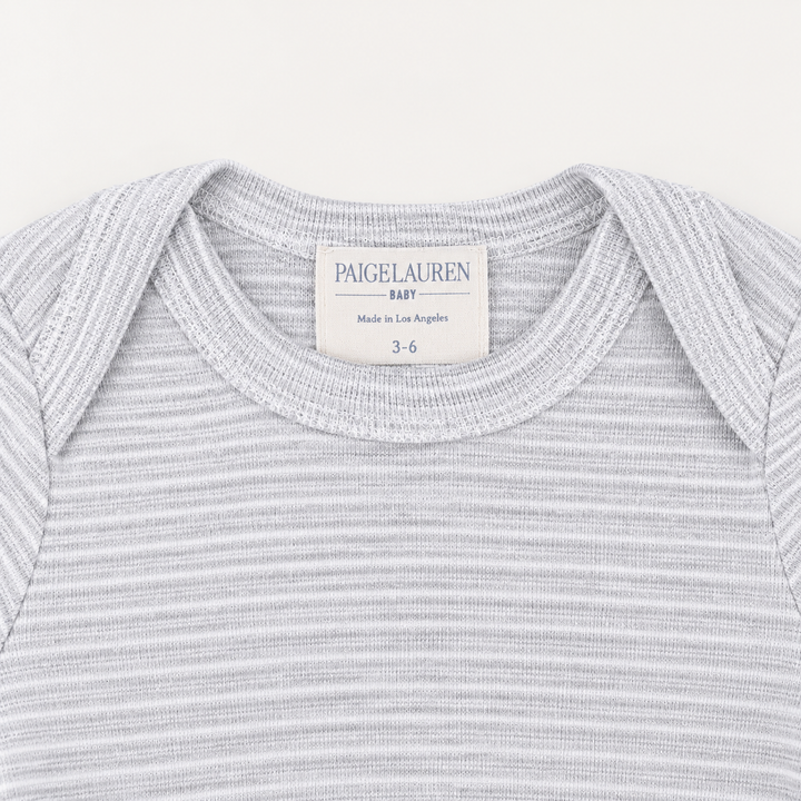 Lap shoulder neckline detail on PAIGELAUREN Heathered Gray Rib Footie Pajama