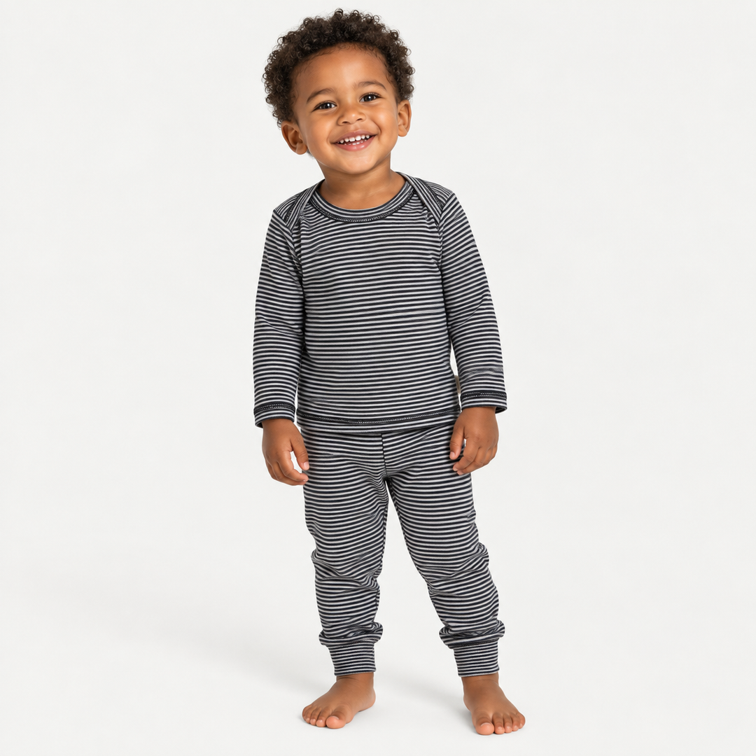 Toddler wearing PAIGELAUREN Black Stripe Rib Lap Tee + Legging Set