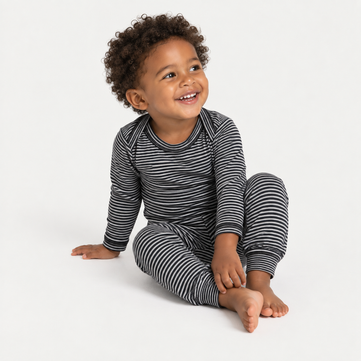 Toddler modeling PAIGELAUREN Black Stripe Rib Lap Tee + Legging Set